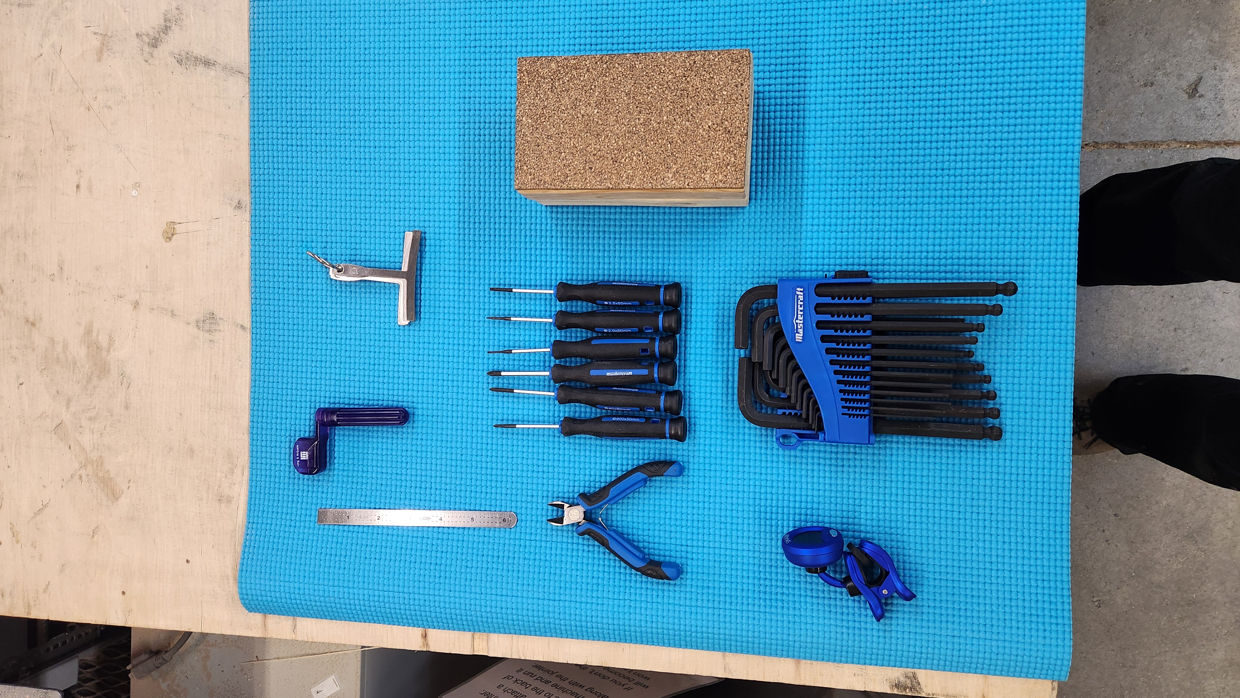 Tools laid out on a blue background - Guitar setup workshop - Guelph Guitar Repair - Guelph ON