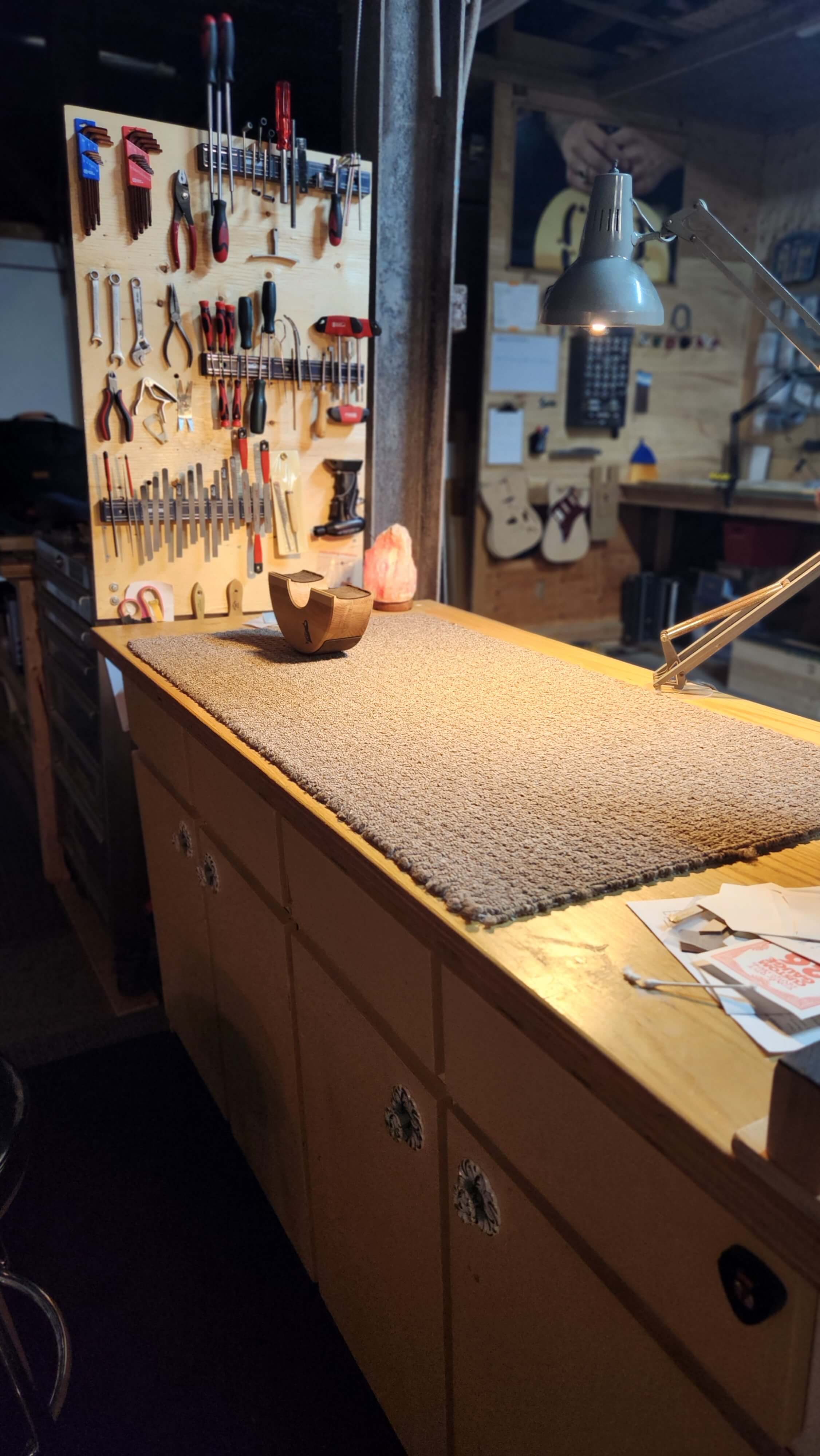 Guelph Guitar Repair after dark. A clean bench and a tidy tool wall. Guelph Guitar Repair